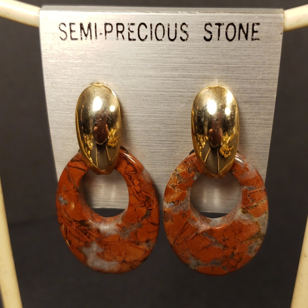 A beautiful pair of stone and gold tone earrings